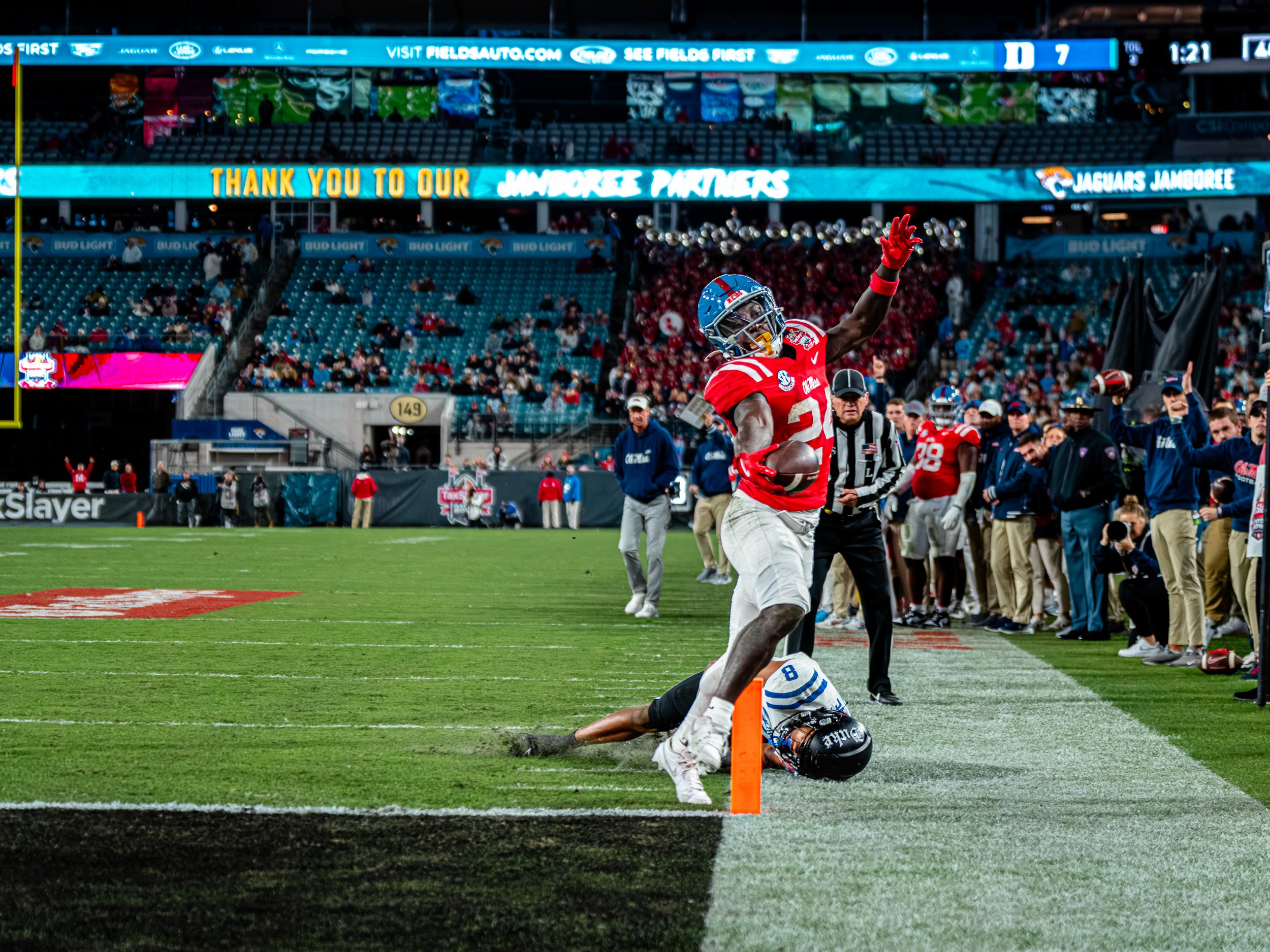 An Ole Miss back stays in bounds along the pylon after shedding a Duke tackler.