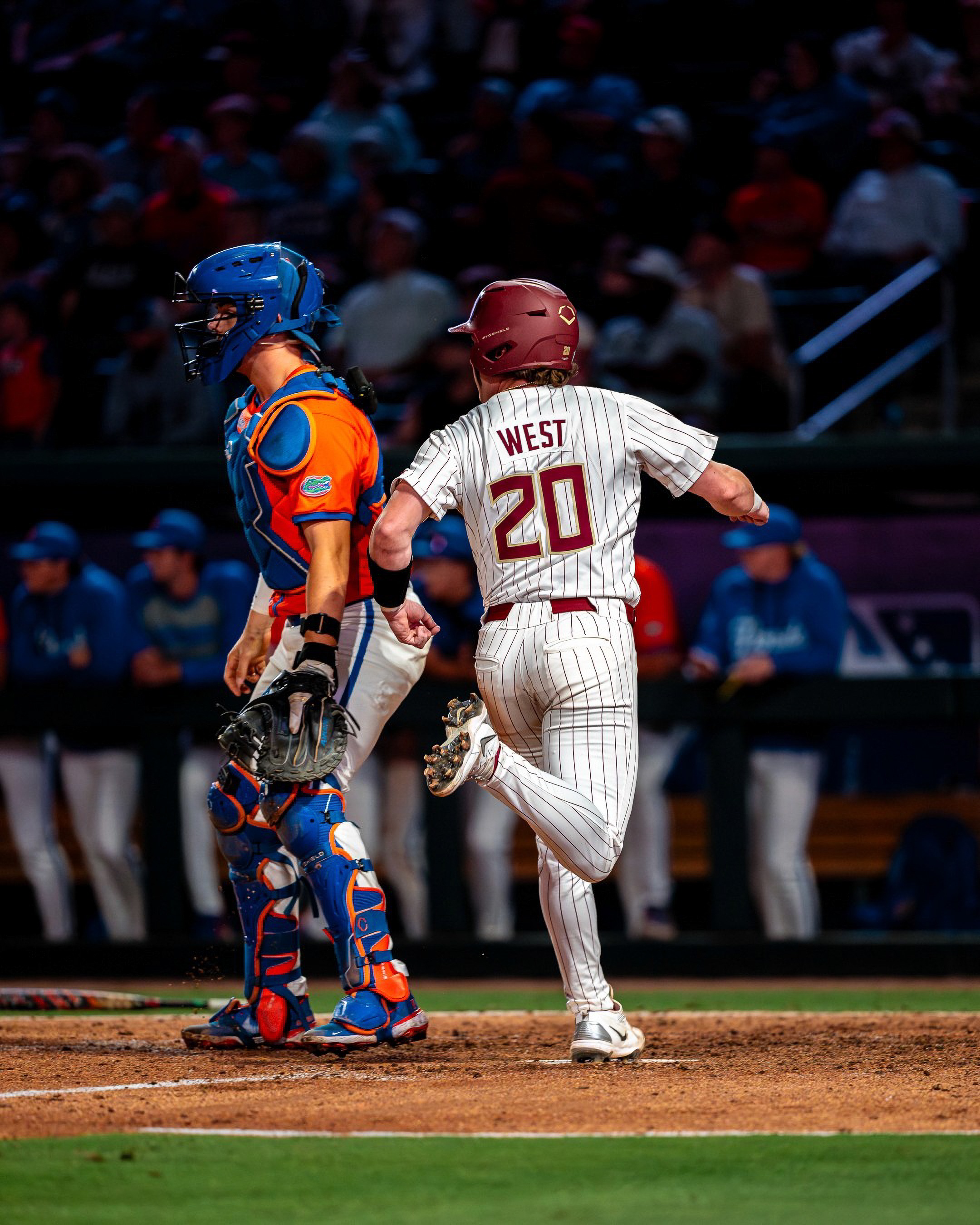 Jaxson West (20) breaks from the box past Florida’s catcher.