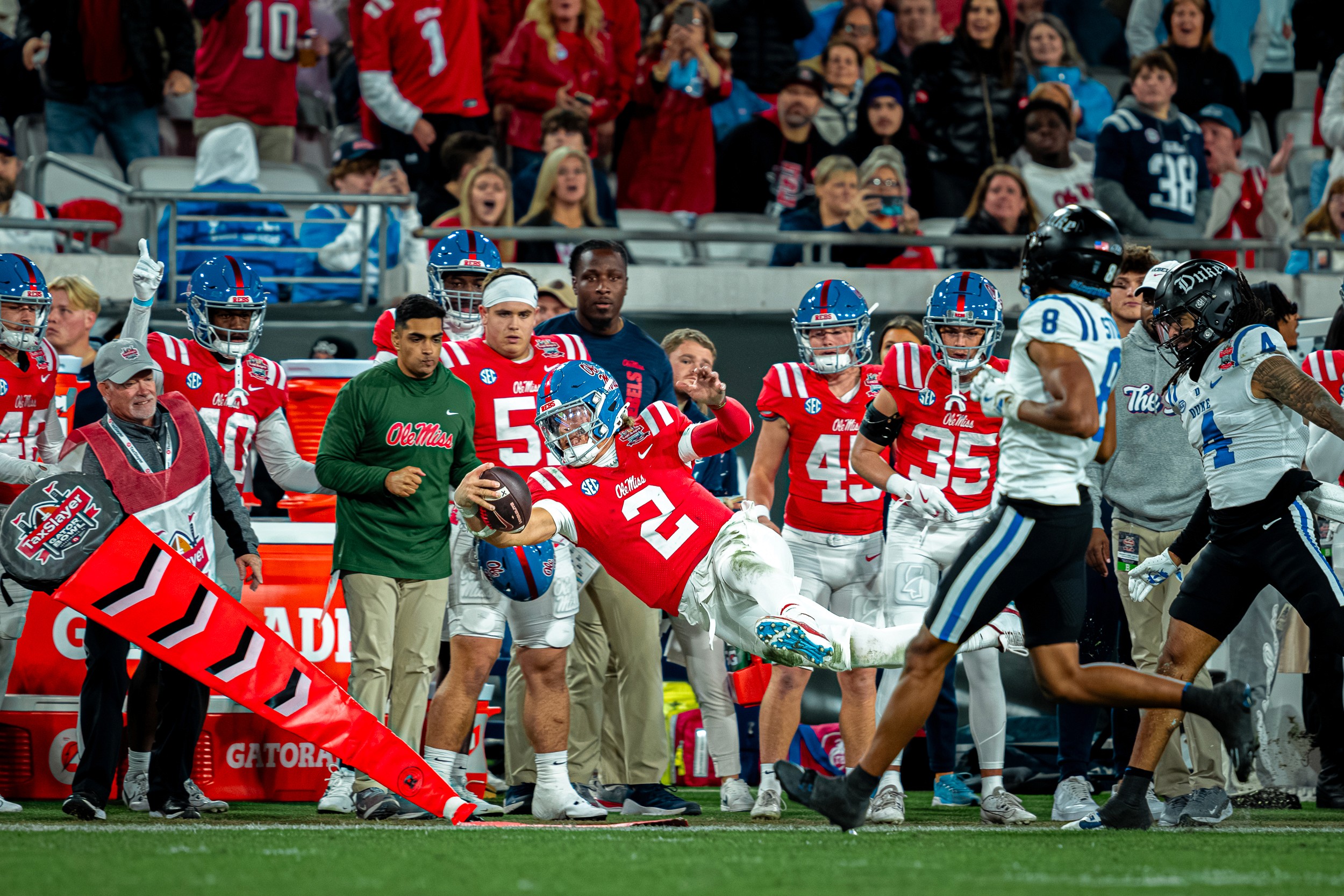Jaxson Dart (2) lays out for the marker along the Ole Miss sideline.