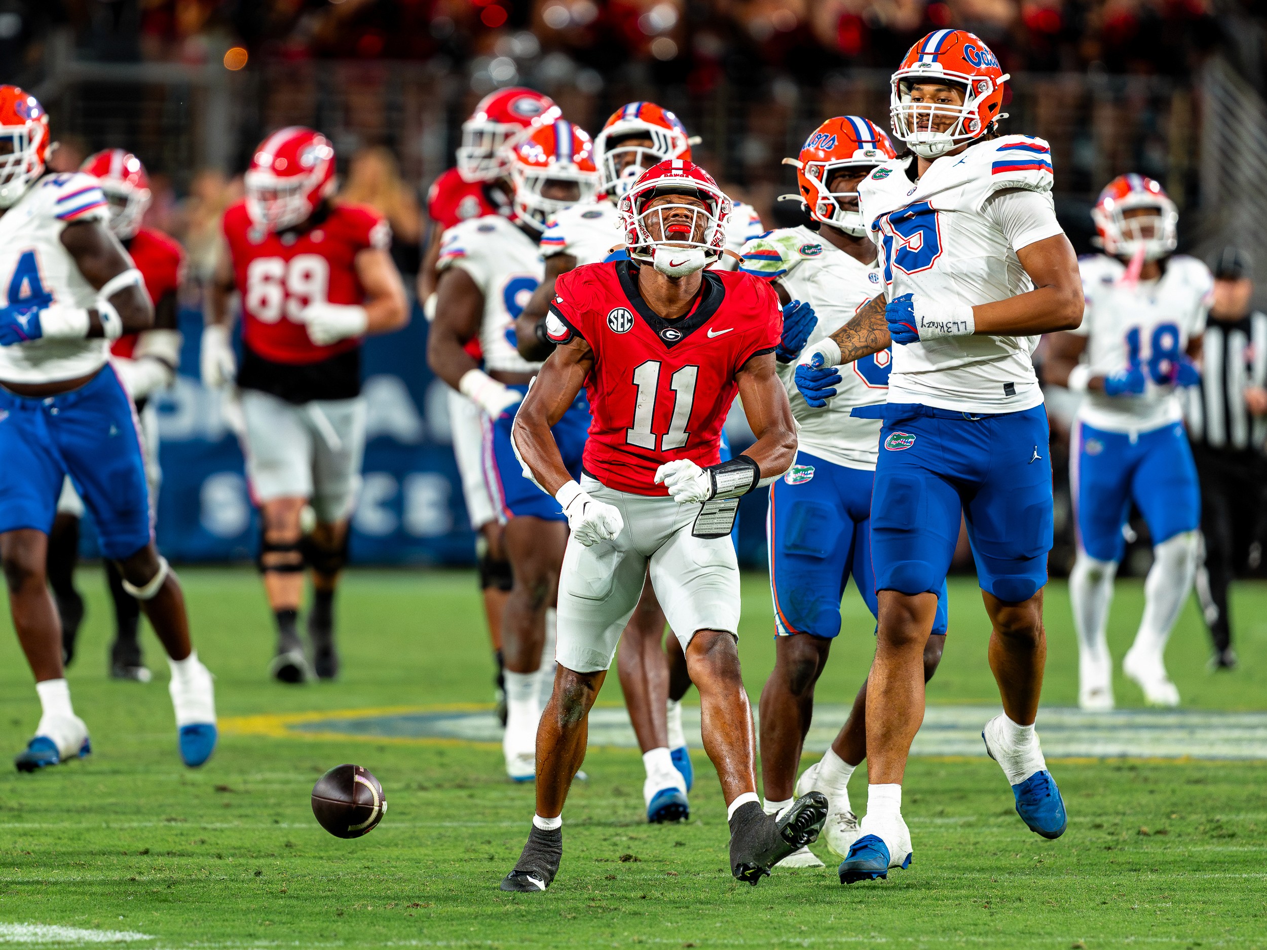 Georgia receiver Arian Smith (11) with the ball loose at his feet among Florida’s linemen.