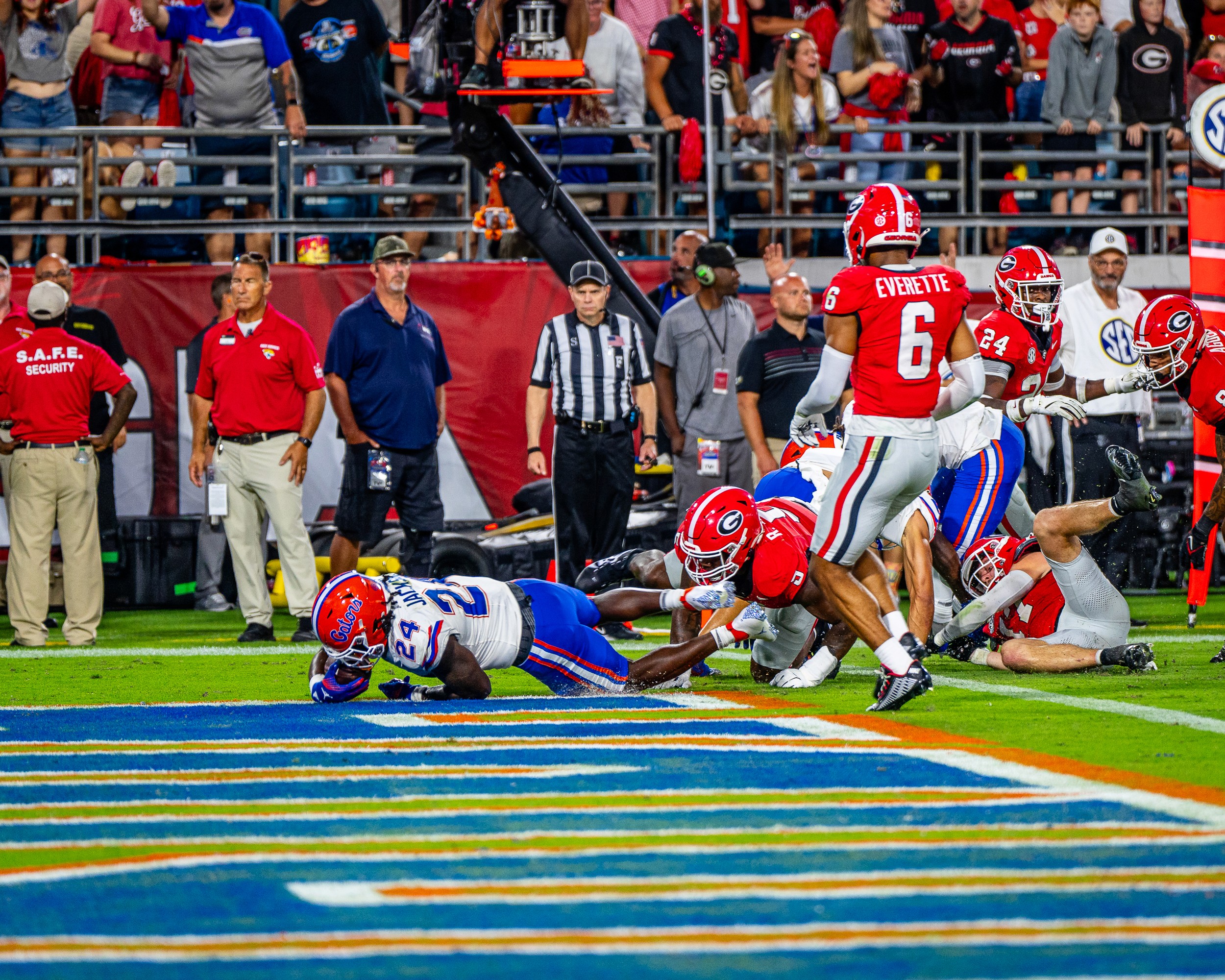Florida running back Jadan Baugh (24) dives for the goal line past Georgia’s Daylen Everette (6).