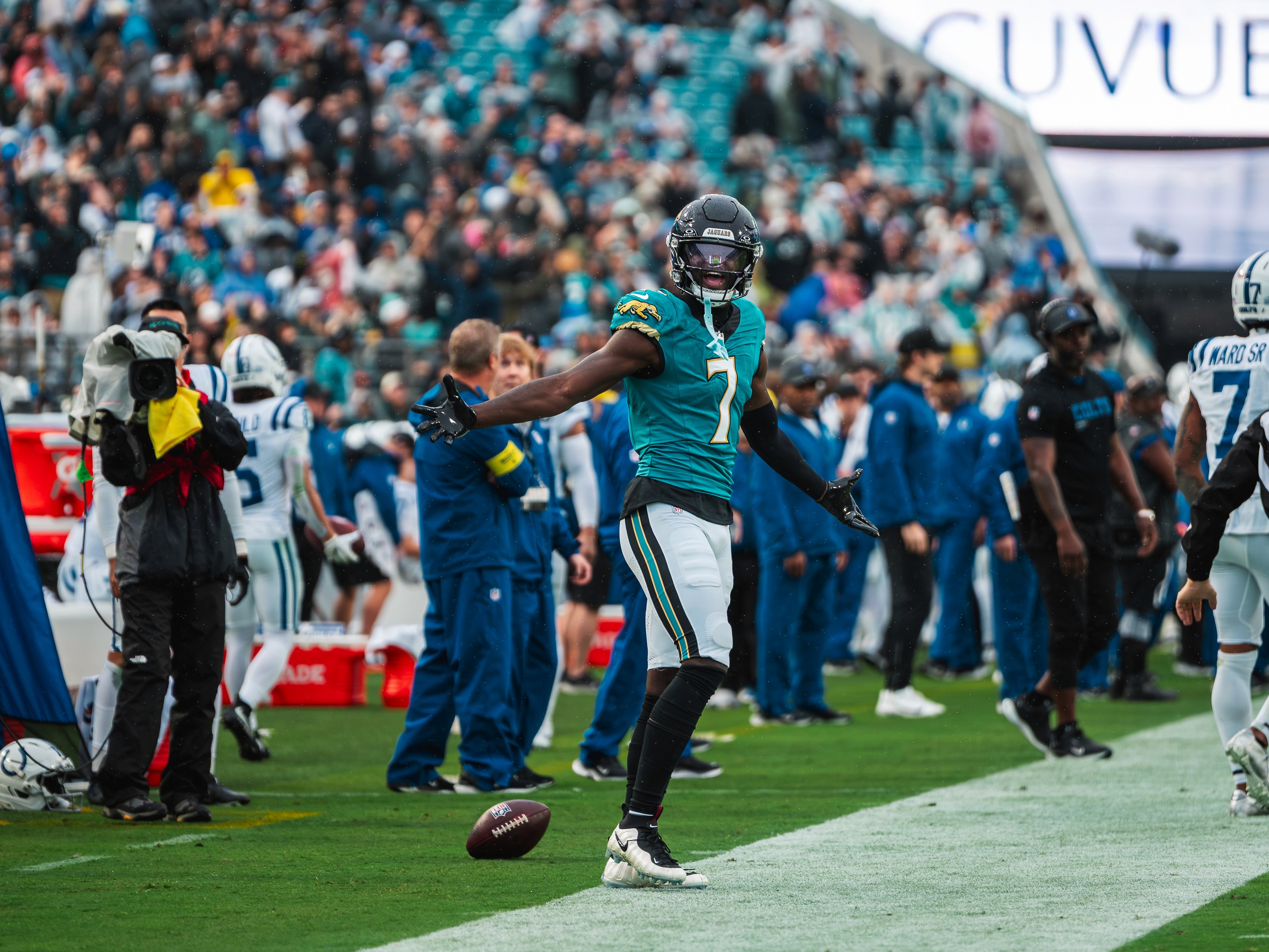 Brian Thomas Jr. (7) opens his arms to the sideline after a play, the ball on the turf behind him.